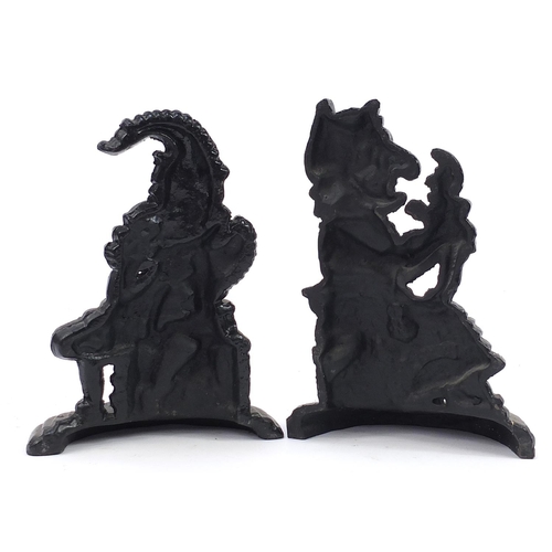 1035 - Pair of cast iron Punch & Judy doorstops, 30cm high