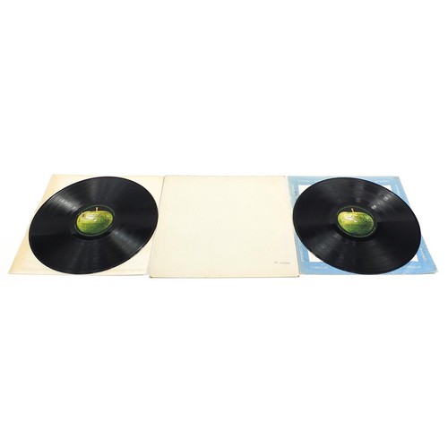 1384 - Four White Album vinyl LP records by The Beatles comprising numbers 0048391, 0123925, 0192572 and on... 