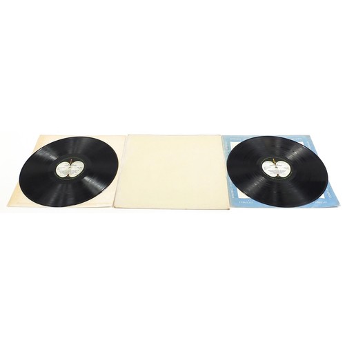 1384 - Four White Album vinyl LP records by The Beatles comprising numbers 0048391, 0123925, 0192572 and on... 