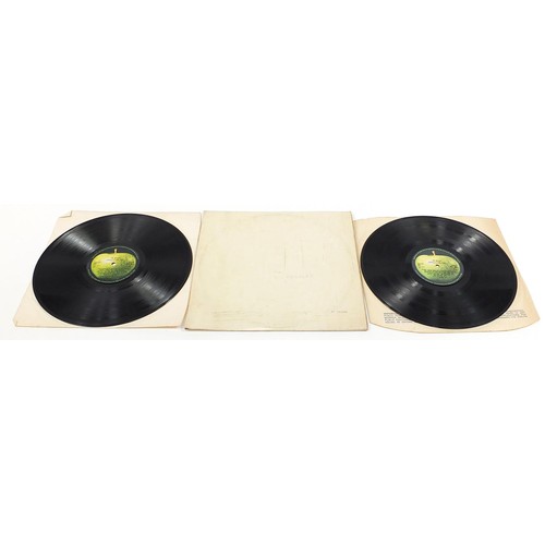 1384 - Four White Album vinyl LP records by The Beatles comprising numbers 0048391, 0123925, 0192572 and on... 