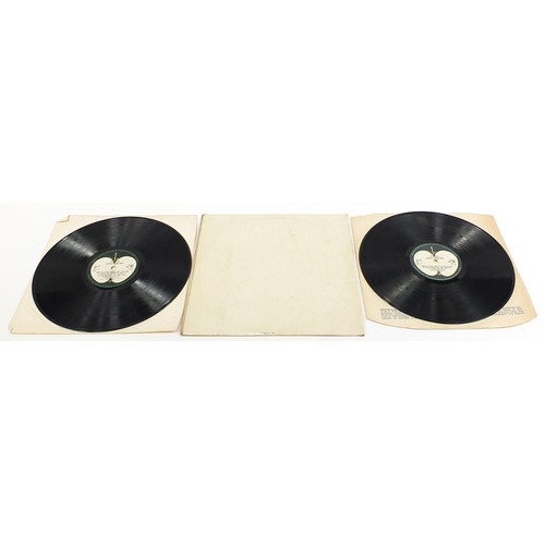 1384 - Four White Album vinyl LP records by The Beatles comprising numbers 0048391, 0123925, 0192572 and on... 