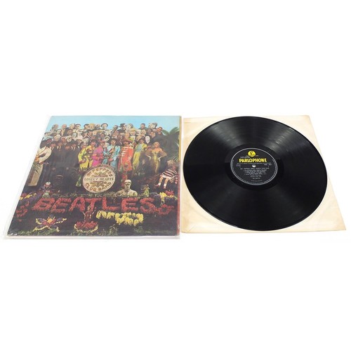 1392 - Four Sgt Pepper's Lonely Hearts Club Band vinyl LP records by The Beatles with cut outs and picture ... 