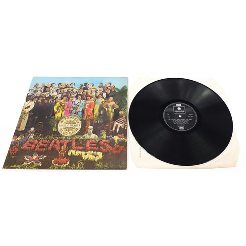 1392 - Four Sgt Pepper's Lonely Hearts Club Band vinyl LP records by The Beatles with cut outs and picture ... 