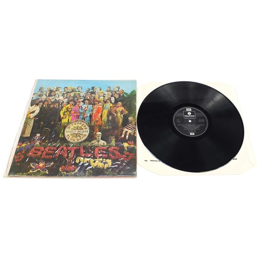 1391 - Seven Sgt Pepper's Lonely Hearts Club Band vinyl LP records by The Beatles, six mono, one stereo, ea... 