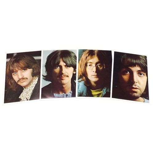 1386 - Four White Album vinyl LP records by The Beatles with posters and photographs comprising numbers 043... 