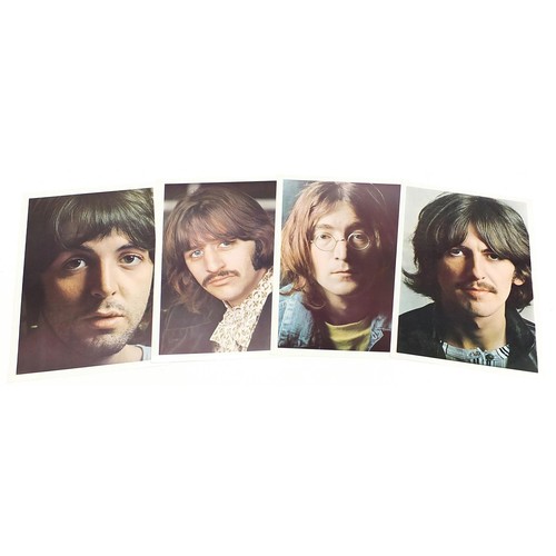 1386 - Four White Album vinyl LP records by The Beatles with posters and photographs comprising numbers 043... 