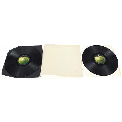 1386 - Four White Album vinyl LP records by The Beatles with posters and photographs comprising numbers 043... 