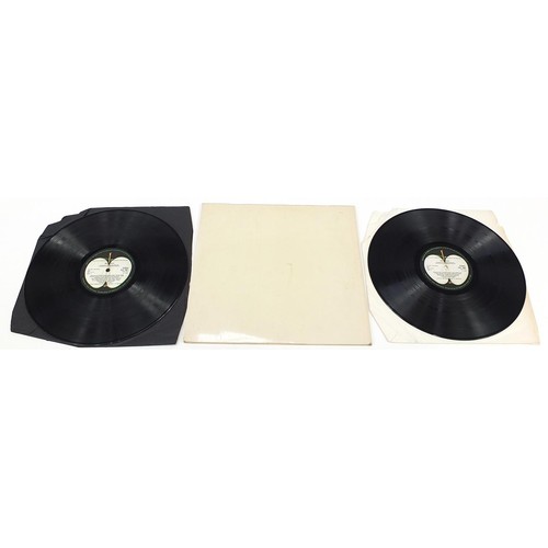 1386 - Four White Album vinyl LP records by The Beatles with posters and photographs comprising numbers 043... 