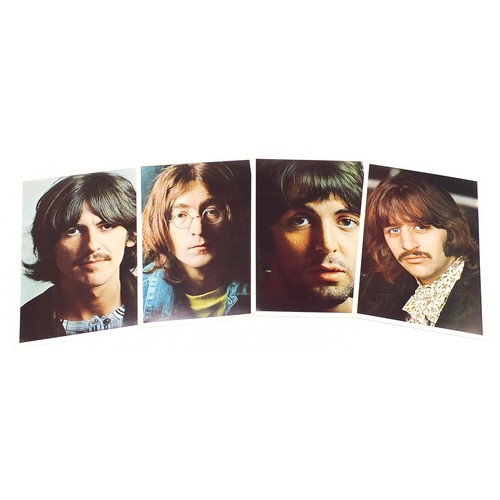 1386 - Four White Album vinyl LP records by The Beatles with posters and photographs comprising numbers 043... 