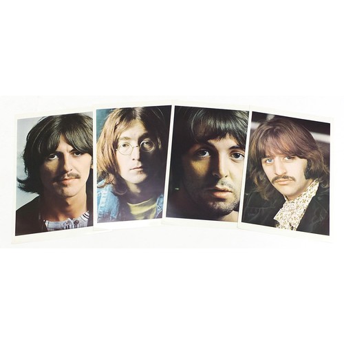 1385 - Four White Album vinyl LP records by The Beatles with poster and four pictures to include numbers 36... 