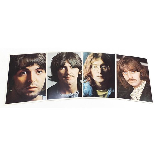 1385 - Four White Album vinyl LP records by The Beatles with poster and four pictures to include numbers 36... 