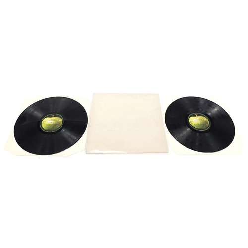 1385 - Four White Album vinyl LP records by The Beatles with poster and four pictures to include numbers 36... 