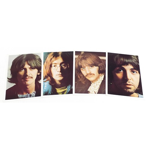 1385 - Four White Album vinyl LP records by The Beatles with poster and four pictures to include numbers 36... 