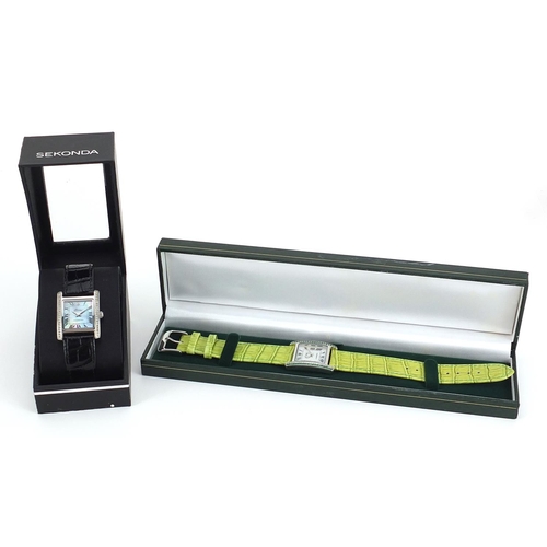 2169 - Two silver wristwatches set with diamonds and emeralds, with certificates