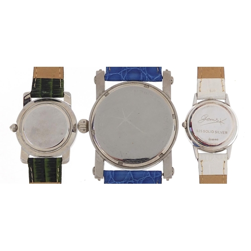 2165 - Three silver wristwatches set with blue sapphires, topaz and aquamarine, with certificates