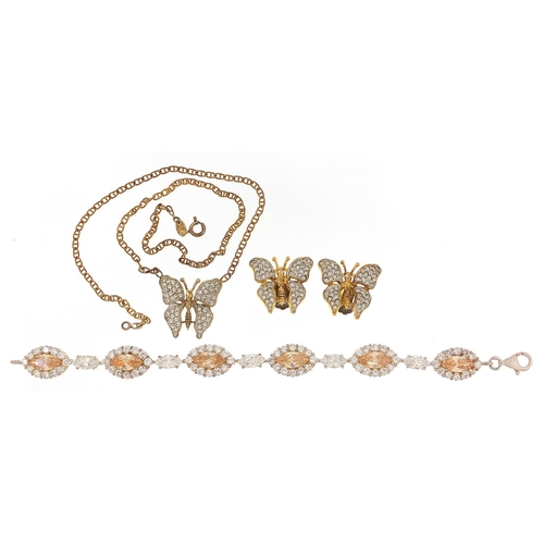 2166 - Silver clear stone butterfly necklace with matching earrings and a silver clear and orange stone bra... 