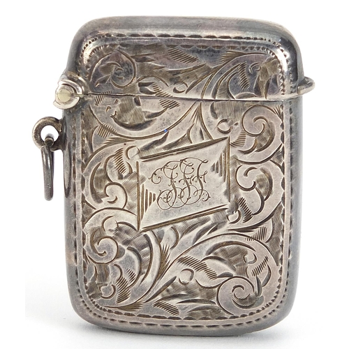 2255 - Henry Williamson Ltd, George V silver vesta engraved with foliage, Birmingham 1914, 4.5cm high, 23.2... 