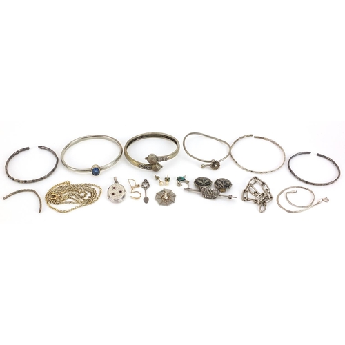 2049 - Silver and white metal jewellery including a marcasite crown brooch, oval locket, bangles and neckla... 