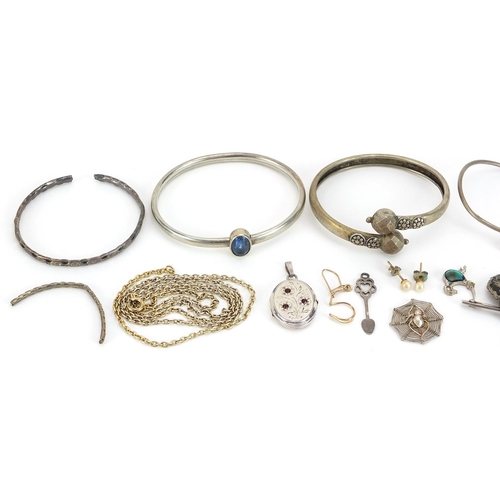 2049 - Silver and white metal jewellery including a marcasite crown brooch, oval locket, bangles and neckla... 