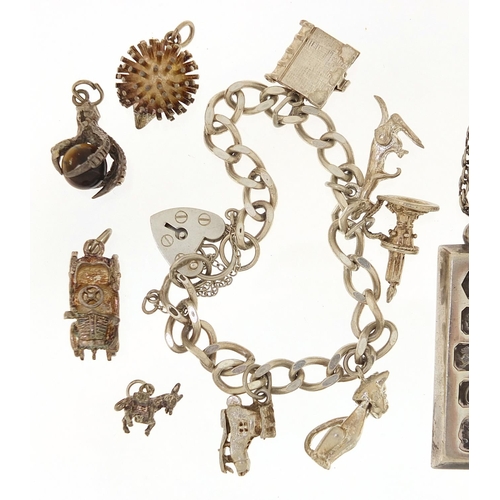 2081 - Silver jewellery comprising charm bracelet, loose charms, ingot pendant on necklace and silver gilt ... 