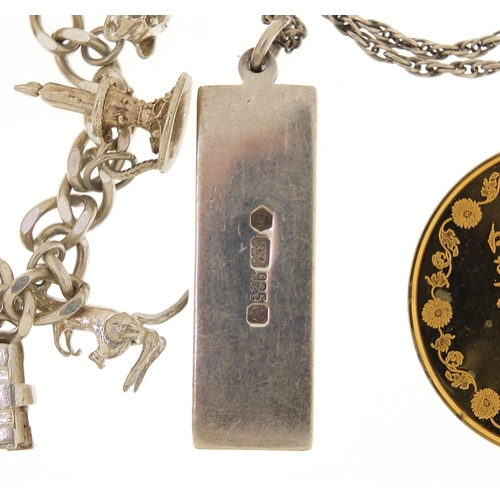 2081 - Silver jewellery comprising charm bracelet, loose charms, ingot pendant on necklace and silver gilt ... 