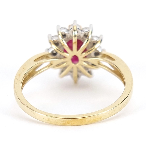 1751 - 9ct gold ruby and diamond cluster ring, the ruby approximately 0.92 carat, total diamond weight appr... 