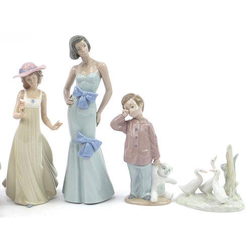 555 - Six Lladro and Nao porcelain figures and ducks, the largest 30cm high