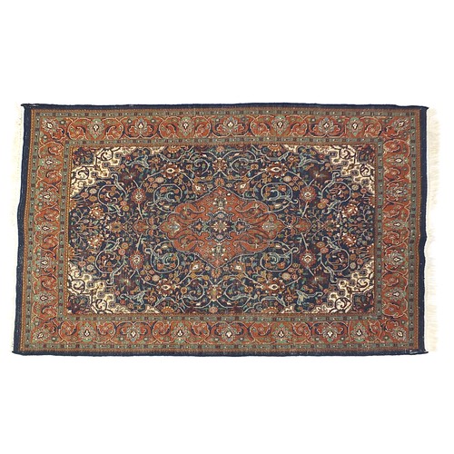 840 - Rectangular blue ground rug having an all over geometric floral design, 205cm x 145cm