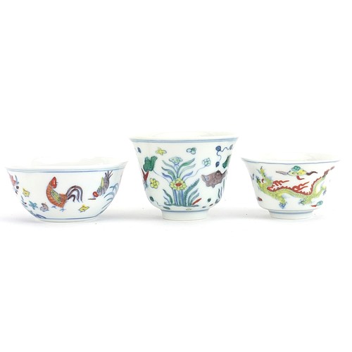 759 - Three Chinese doucai porcelain tea bowls including one hand painted with chickens, various character... 