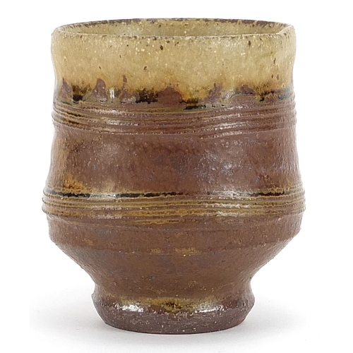 65 - Phil Rogers, studio pottery footed bowl having a salt glaze with impressed mark, 10cm high