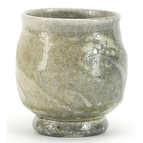 64 - Ruthanne Tudball, studio pottery chawan having a soda glaze with impressed marks, 9cm high