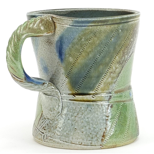 165 - Jane Hamlyn, studio pottery mug having a salt glaze with incised decoration and impressed mark, 10cm... 