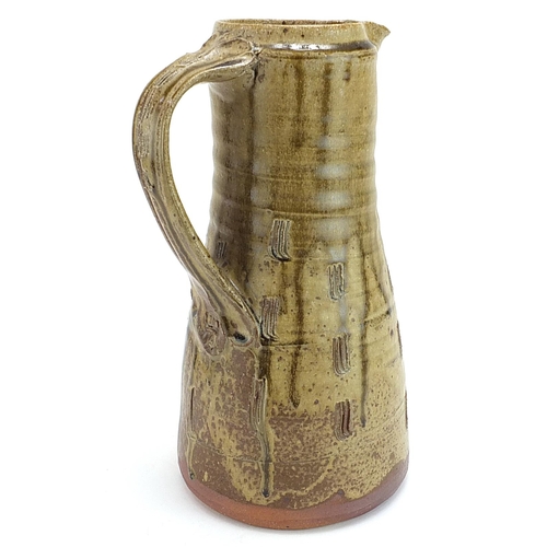 18 - Jim Malone for Ainstable, studio pottery jug with incised decoration, impressed marks to the handle,... 