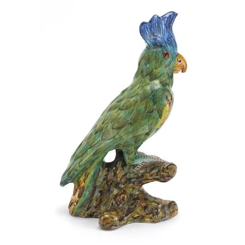 264 - Mosanic, continental pottery parrot with beaded eyes, 26.5cm high