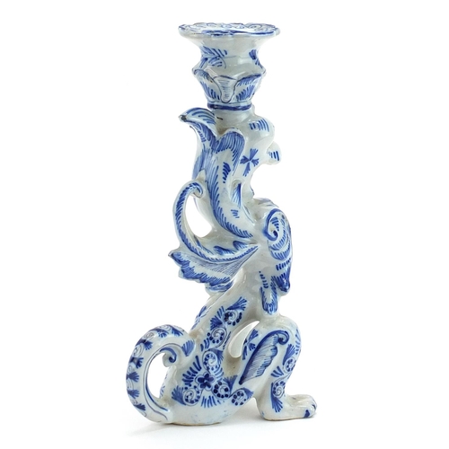 498 - Faience glazed candlestick in the form of a dragon, 24.5cm high