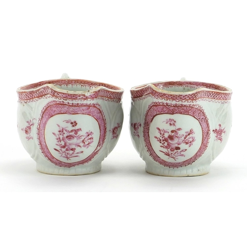 84 - Pair of Chinese porcelain pink monochrome sauce boats hand painted with flowers, each 19cm in length