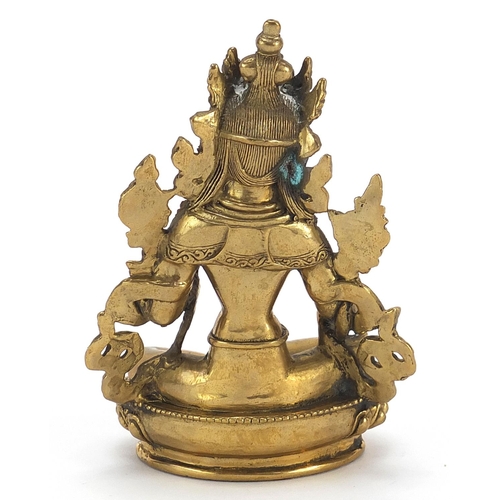 114 - Chino Tibetan gilt bronze figure of buddha, 11cm high