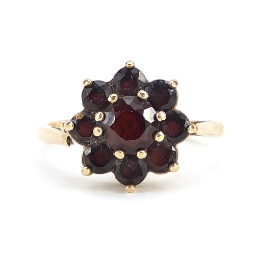 1927 - 9ct gold garnet flower head ring, size P, 3.4g