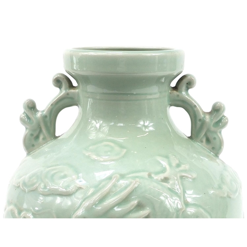 344 - Large Chinese porcelain vase on stand with twin handles having a celadon glaze, decorated in relief ... 