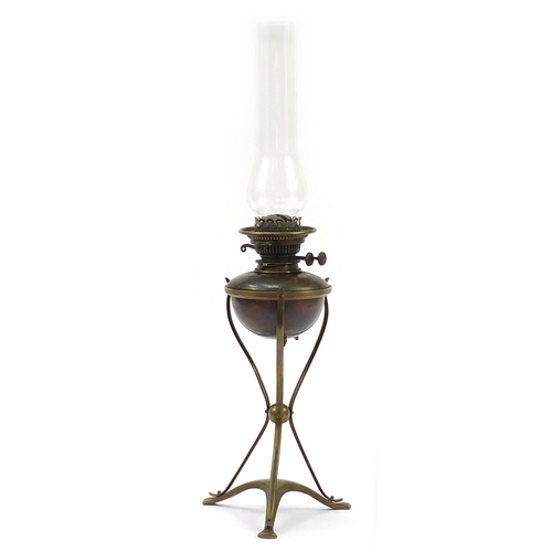 1262 - Manner of W A S Benson, Arts & Crafts copper and brass oil lamp with glass flute, overall 71cm high