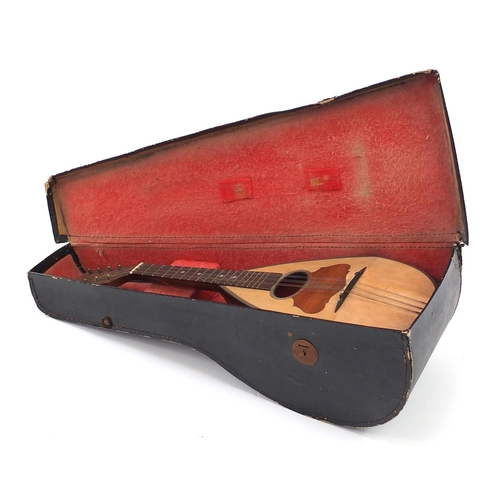 414 - Inlaid rosewood melon shaped mandolin with protective carry case, Pietro Tonelli label to the interi... 