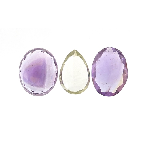 1931 - Three gemstones with certificates comprising amethyst 16.100 carat, green amethyst 5.900 carat and a... 