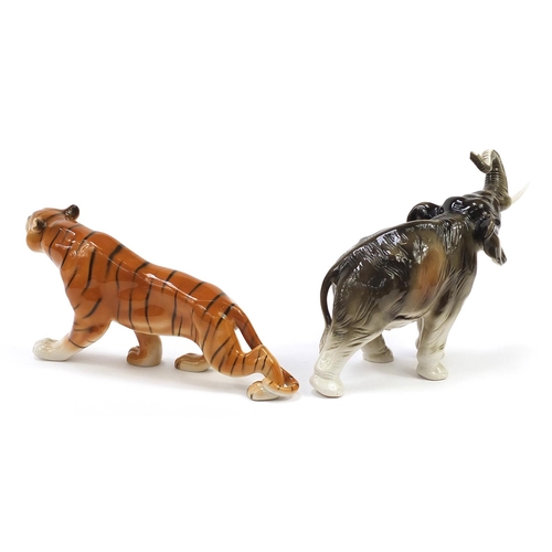 544 - Royal Dux, Czechoslovakian porcelain elephant and tiger, the largest 36cm in length