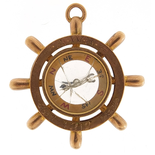 1725 - 9ct rose gold ship's wheel compass pendant engraved 1912, 3.3cm in diameter, 7.6g