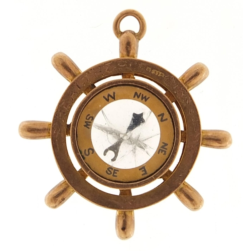 1725 - 9ct rose gold ship's wheel compass pendant engraved 1912, 3.3cm in diameter, 7.6g