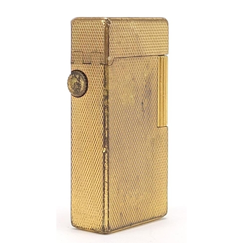 128 - Dunhill gold plated pocket lighted with engine turned decoration, 6cm high