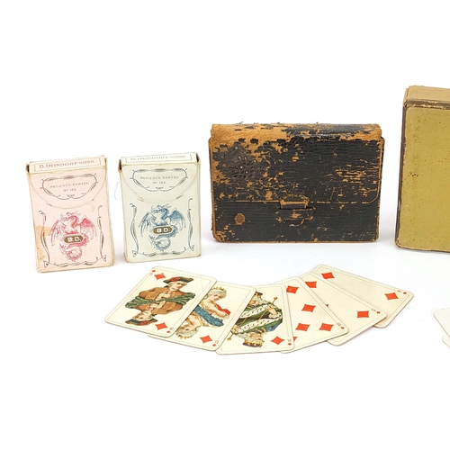 1375 - Four packets of vintage playing cards retailed by Hermes Paris and Lovegrove & Flint