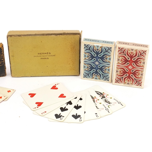 1375 - Four packets of vintage playing cards retailed by Hermes Paris and Lovegrove & Flint