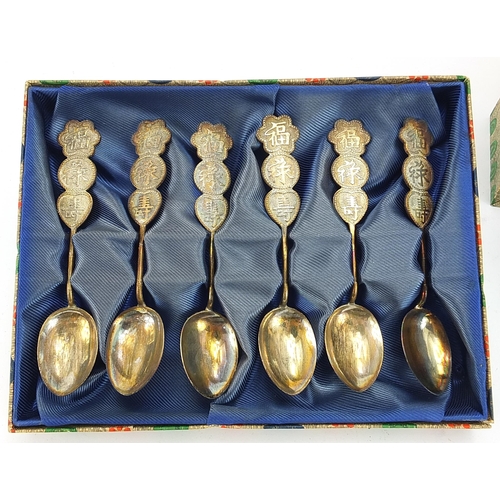 2230 - Chinese white metal model junk and set of six teaspoons, both with fitted display cases, the largest... 