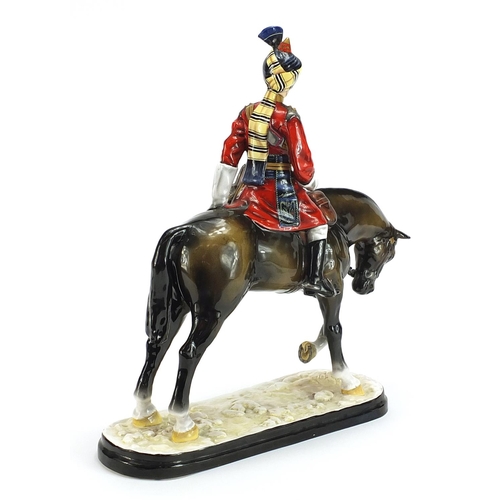 1291 - Michael Sutty large porcelain figure of a soldier on horseback, 38cm high